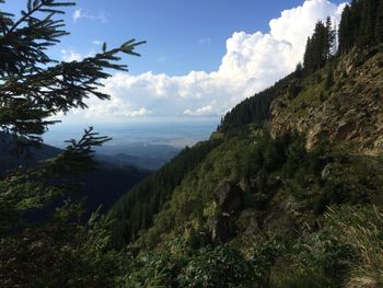 Scenic view of sea and mountains against sky