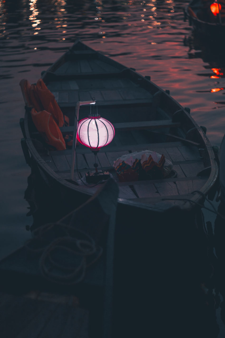 HIGH ANGLE VIEW OF ILLUMINATED LAMP IN RIVER