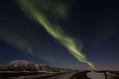 Scenic view of mountains against sky at night