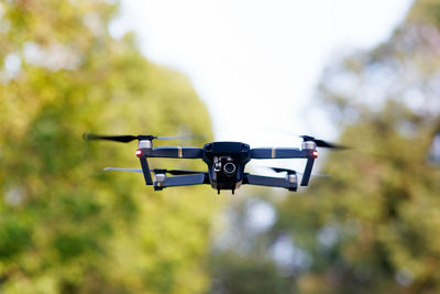 Low angle view of drone against sky