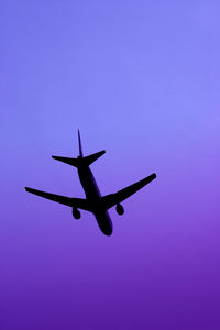 Low angle view of airplane flying in sky
