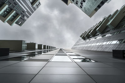 Low angle view of modern buildings against sky