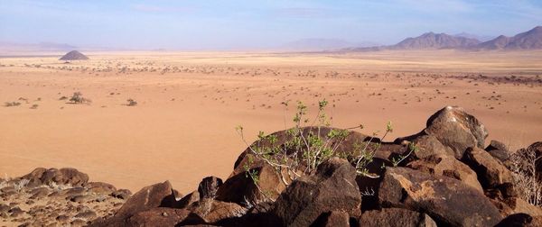 Panoramic view of desert against sky