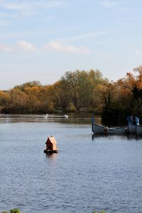 Boat in lake against sky