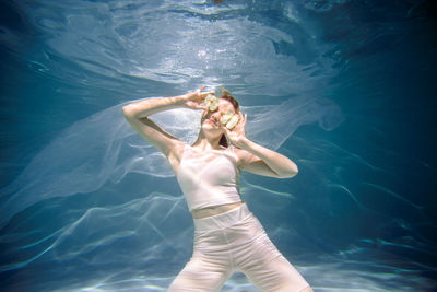 Young woman swimming in pool