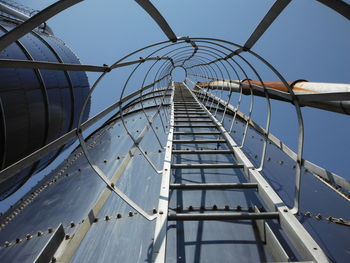 Low angle view of metal structure against sky