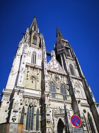 Low angle view of temple building against blue sky