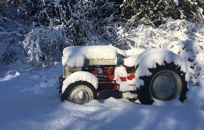 High angle view of snow covered car on field