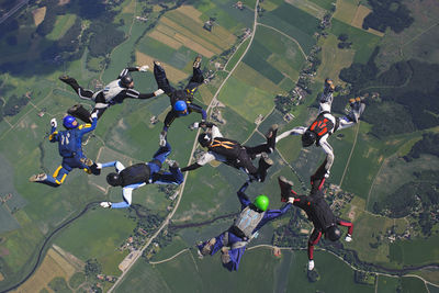 Skydivers in formation mid-air