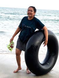 Portrait of smiling young man on beach