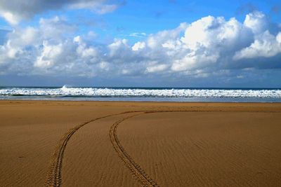 Scenic view of beach against sky