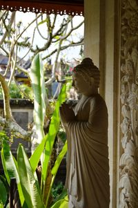 Statue of buddha against temple