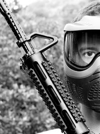 Close-up portrait of man wearing helmet outdoors