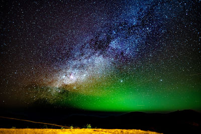 Scenic view of star field against sky at night