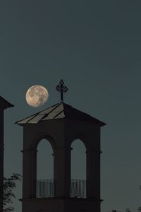 Low angle view of building against sky at dusk