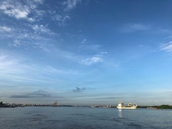 Scenic view of sea against blue sky