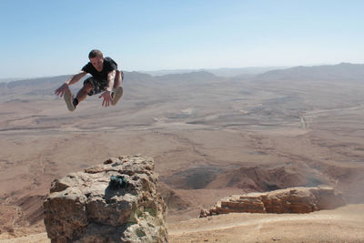 Full length of man in desert against clear sky