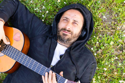 Portrait of man playing guitar