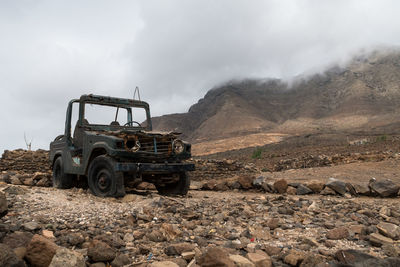 Old jeep in the middle of nowhere, rocky environment in tenerife