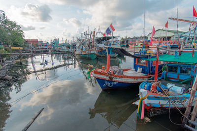 Boats moored at harbor