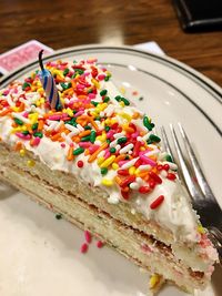 Close-up of multi colored cake on table