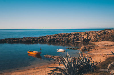 Scenic view of sea against clear sky