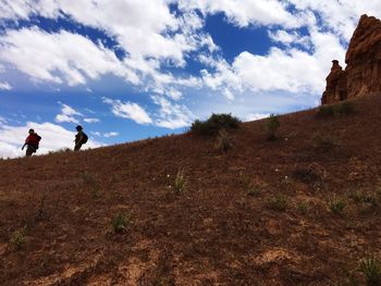 Man on field against sky