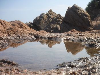 Scenic view of rock formations against sky