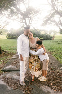 Rear view of woman standing on field