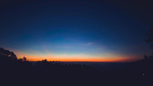 Scenic view of silhouette landscape against romantic sky at sunset