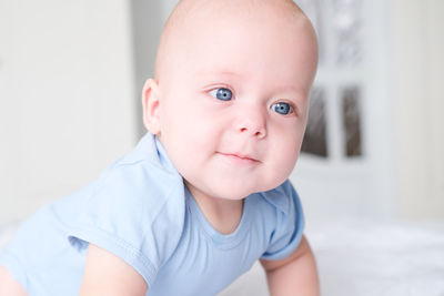 Close-up of cute baby boy at home