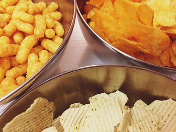 High angle view of snacks in bowls on table