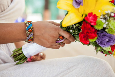 Close-up of hands holding flowers