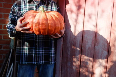 View of man holding pumpkin