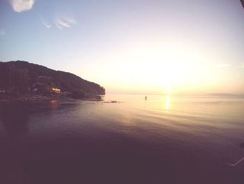 Scenic view of sea against sky at sunset