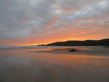 Scenic view of dramatic sky over landscape