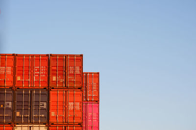 Low angle view of red building against clear sky