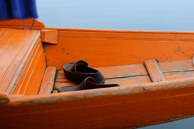 High angle view of shoes in boat over sea
