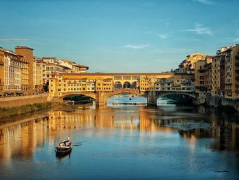 Bridge over river against sky florence italy 