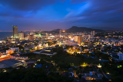 High angle view of illuminated city buildings at night