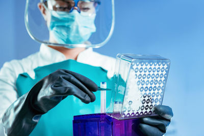 Female scientist experimenting in laboratory