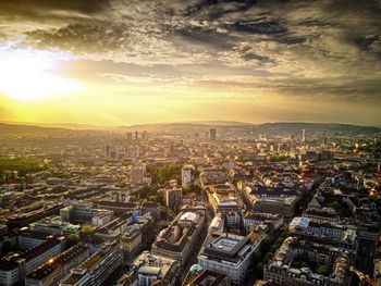 High angle view of city at sunset