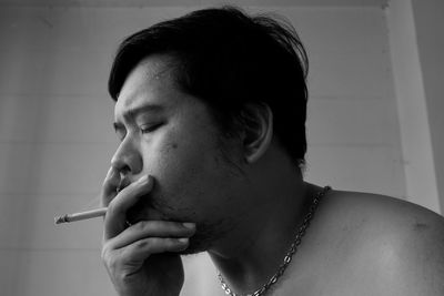 Portrait of man smoking cigarette