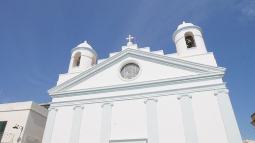 Low angle view of building against blue sky