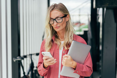 Young woman using mobile phone