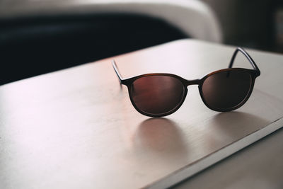 Close-up of sunglasses on table