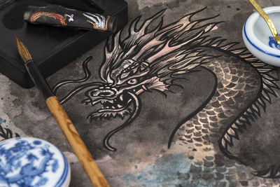 High angle view of dragon painting