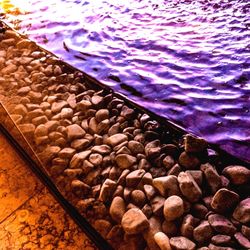 High angle view of stones in sea