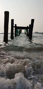 Pier over sea against clear sky