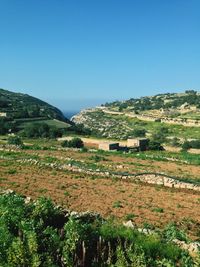 Scenic view of landscape against clear blue sky